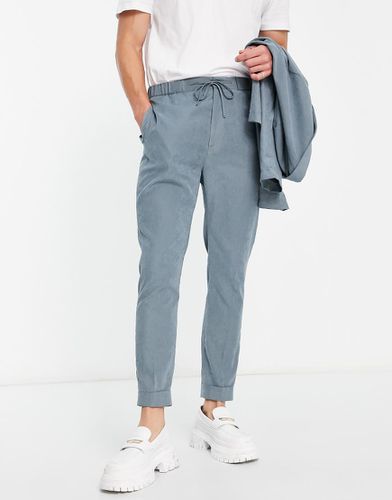 Pantaloni affusolati da abito stile joggers in camoscio sintetico tenue - ASOS DESIGN - Modalova