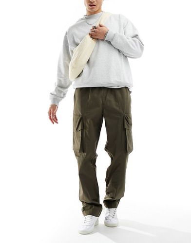 Pantaloni cargo ampi in tessuto ripstop con vita elasticizzata kaki - ASOS DESIGN - Modalova