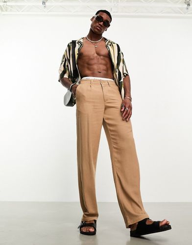 Pantaloni chino comodi in misto lino color cuoio - ASOS DESIGN - Modalova