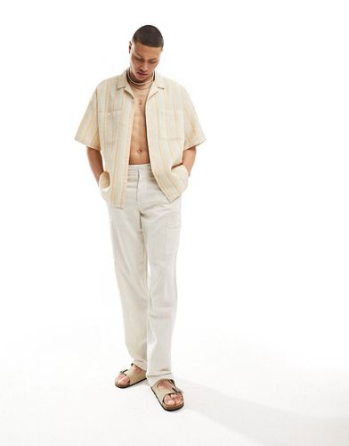Pantaloni comodi beige chiaro testurizzato - ASOS DESIGN - Modalova