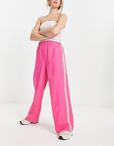 Pantaloni con vita elasticizzata con riga laterale color pietra - ASOS DESIGN - Modalova