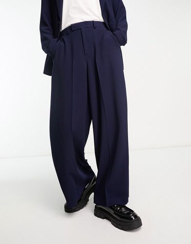 Pantaloni da abito con fondo molto ampio in crêpe - ASOS DESIGN - Modalova