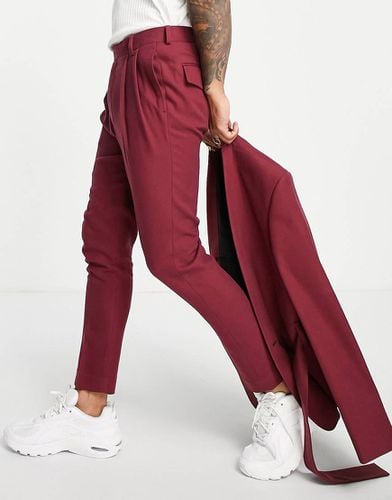 Pantaloni da abito stretti in fondo bordeaux - ASOS DESIGN - Modalova