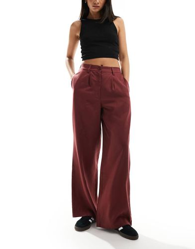 Pantaloni dad fit bordeaux slavato - ASOS DESIGN - Modalova