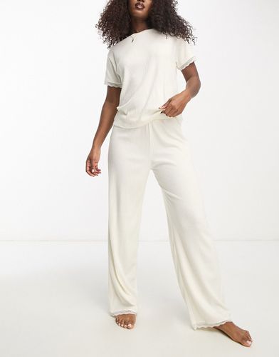 Pantaloni del pigiama mix & match color crema a coste e in pizzo - ASOS DESIGN - Modalova