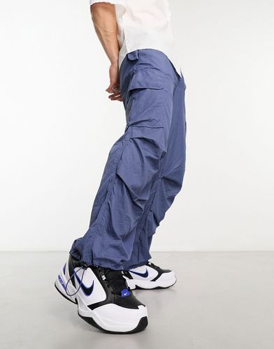 Pantaloni in tessuto ripstop a fondo ampio stile cargo - ASOS DESIGN - Modalova