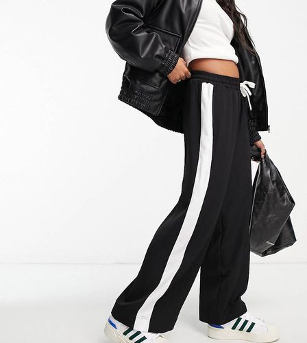 ASOS DESIGN Petite - Pantaloni neri con pannello a contrasto - ASOS Petite - Modalova