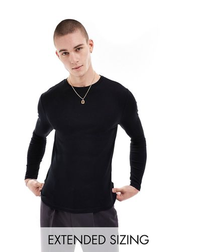 T-shirt attillata a maniche lunghe nera a coste - ASOS DESIGN - Modalova