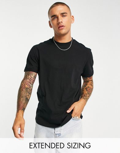 T-shirt girocollo nera con maniche con risvolto - ASOS DESIGN - Modalova