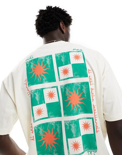 T-shirt oversize sporco con stampa di riquadri con sole sul petto e sul retro - ASOS DESIGN - Modalova