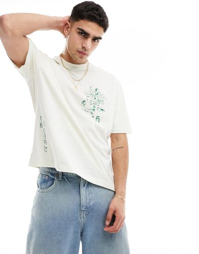 T-shirt oversize bianco sporco con stampe floreali multiple - ASOS DESIGN - Modalova