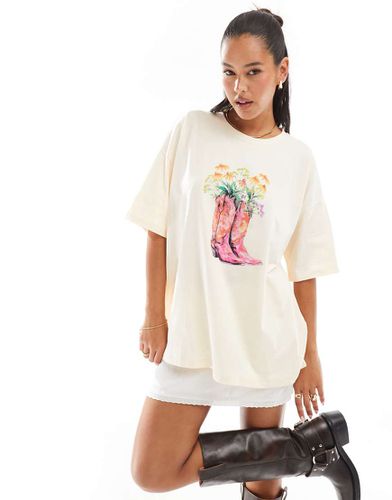 T-shirt oversize écru con grafica con fiori e stivali da cowboy - ASOS DESIGN - Modalova