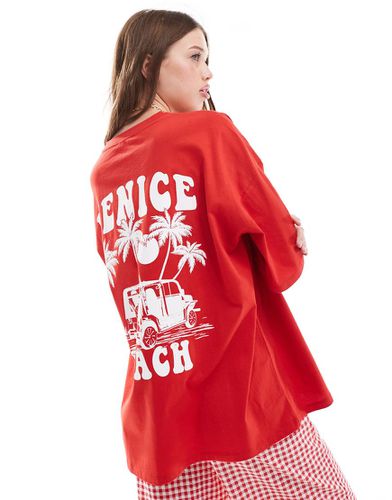 T-shirt oversize rossa con stampa di Venice Beach - ASOS DESIGN - Modalova