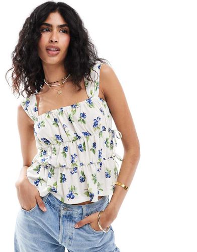 Top milkmaid a fiori con fondo peplo - ASOS DESIGN - Modalova