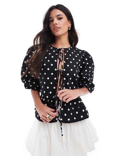 Top peplo in popeline di cotone nero con laccetti e stampa a pois bianchi - ASOS DESIGN - Modalova