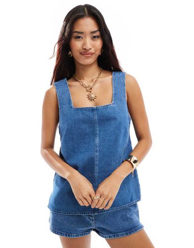 Top senza maniche lungo in denim color medio - ASOS DESIGN - Modalova