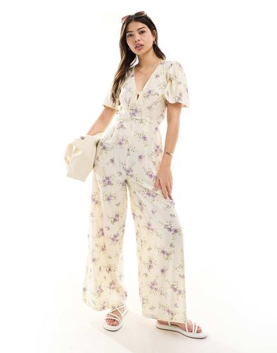 Tuta jumpsuit a fondo ampio con manica con volant e stampa a fiori - ASOS DESIGN - Modalova