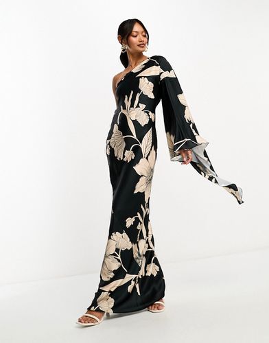 Vestito lungo in raso nero a fiori monospalla con dettaglio sul retro e manica svasata - ASOS DESIGN - Modalova