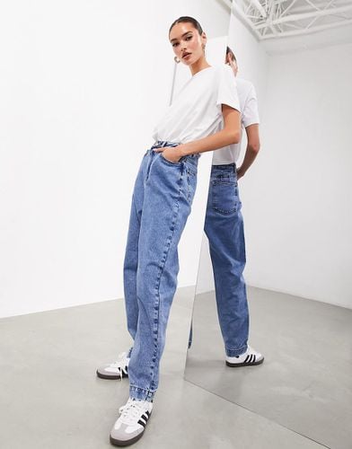 Jeans classici affusolati lavaggio medio - ASOS EDITION - Modalova