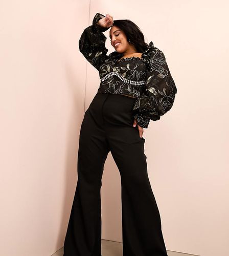 Curve - Pantaloni seducenti a zampa neri - ASOS Luxe - Modalova