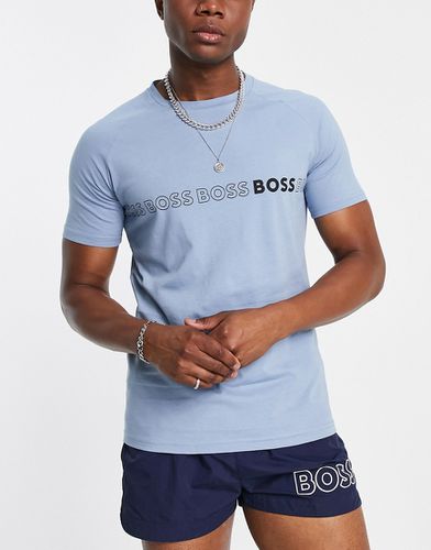 BOSS - T-shirt da mare azzurra slim fit con logo ripetuto al centro - BOSS Bodywear - Modalova