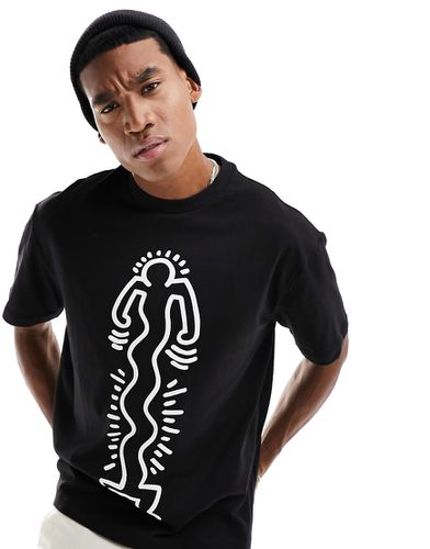 T-shirt nera con stampa "Keith Haring" - Bershka - Modalova
