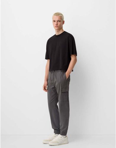 Pantaloni cargo taglio dritto scuro - Bershka - Modalova