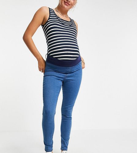 Chloe - Jeans skinny elasticizzati con fascia sotto il pancione, lavaggio medio - Don't Think Twice Maternity - Modalova