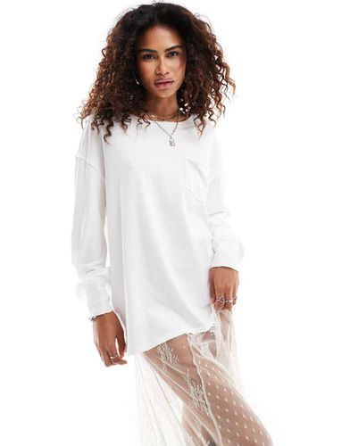 Fade - T-shirt a maniche lunghe color avorio con tasca applicata - Free People - Modalova