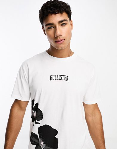 T-shirt bianca con stampa a fiori e logo centrale - Hollister - Modalova