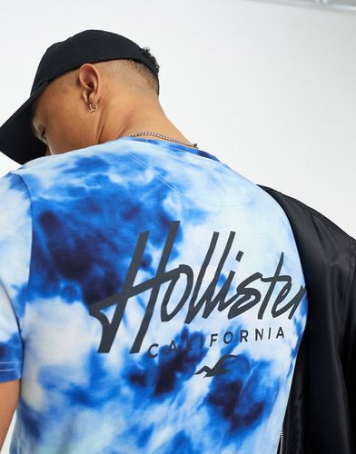 T-shirt taglio lungo con logo sul petto e sul retro lavaggio acido - Hollister - Modalova