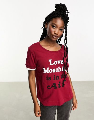 T-shirt con scritta " Is In The Hair" - Love Moschino - Modalova