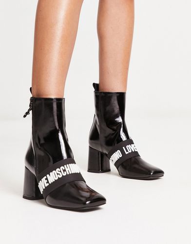 Stivali con tacco in pelle nera con logo - Love Moschino - Modalova