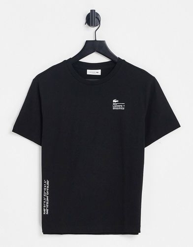 T-shirt nera con logo - Lacoste - Modalova