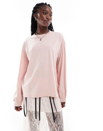 Top a maniche lunghe pesante oversize color pesca slavato - Monki - Modalova