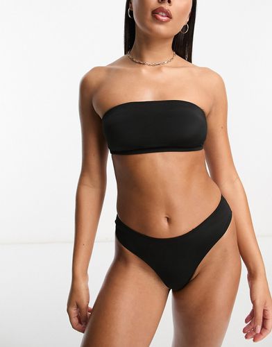 Top bikini a fascia nero in coordinato - Monki - Modalova