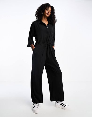 Tuta jumpsuit nera a maniche lunghe con colletto - Monki - Modalova