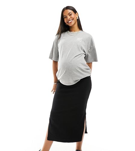 Mamalicious Maternity - Gonna di jeans premaman nera con spacchi laterali e fascia sopra il pancione - Mama.licious - Modalova