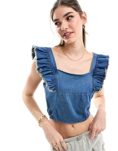 Corsetto in denim lavaggio indaco con volant - Miss Selfridge - Modalova