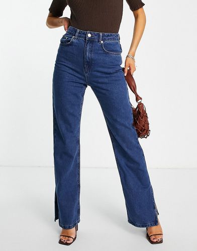 Jeans a vita alta con spacco laterale, colore medio - NA-KD - Modalova