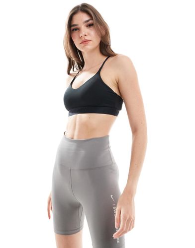 Indy Dri-FIT - Reggiseno nero a supporto leggero - Nike Training - Modalova