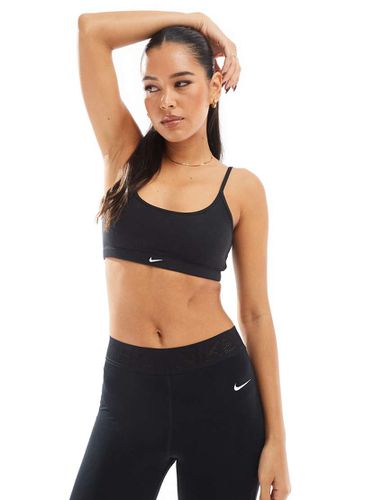 Reggiseno sportivo a sostegno leggero a coste - Nike Training - Modalova