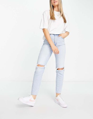 Mom jeans slim elasticizzati con strappi vintage - Stradivarius - Modalova