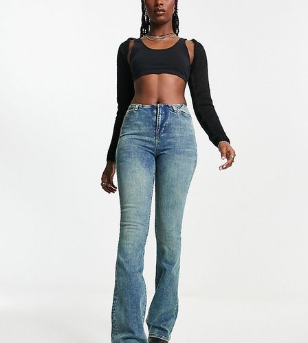 Jeans a zampa skinny elasticizzati senza girovita lavaggio medio - Reclaimed Vintage - Modalova