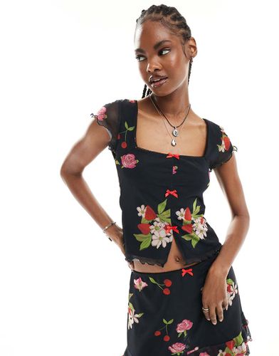 Top con maniche a sbuffo stile babydoll nero con stampa di frutta e fiori vintage e fiocchi - Reclaimed Vintage - Modalova