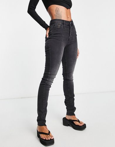 Jeans skinny a vita alta slavato con spacco con zip sul fondo - River Island - Modalova