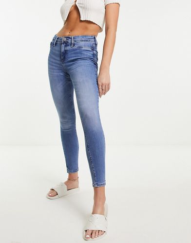Jeans skinny a vita medio alta, colore medio slavato - River Island - Modalova