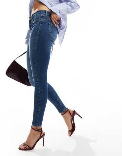 Jeans skinny modellanti lavaggio medio a vita medio alta - River Island - Modalova