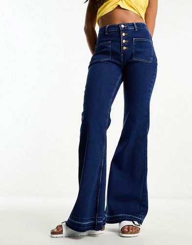 Jeans a zampa a vita alta con bottoni - Wrangler - Modalova