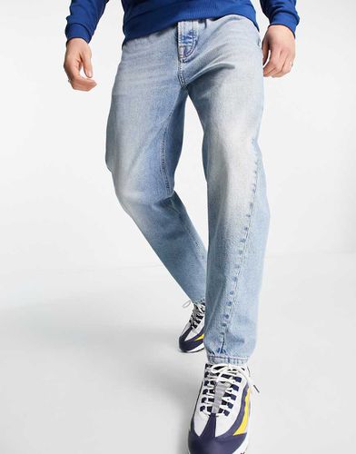 Jeans affusolati con fondo curvo lavaggio azzurro - Topman - Modalova